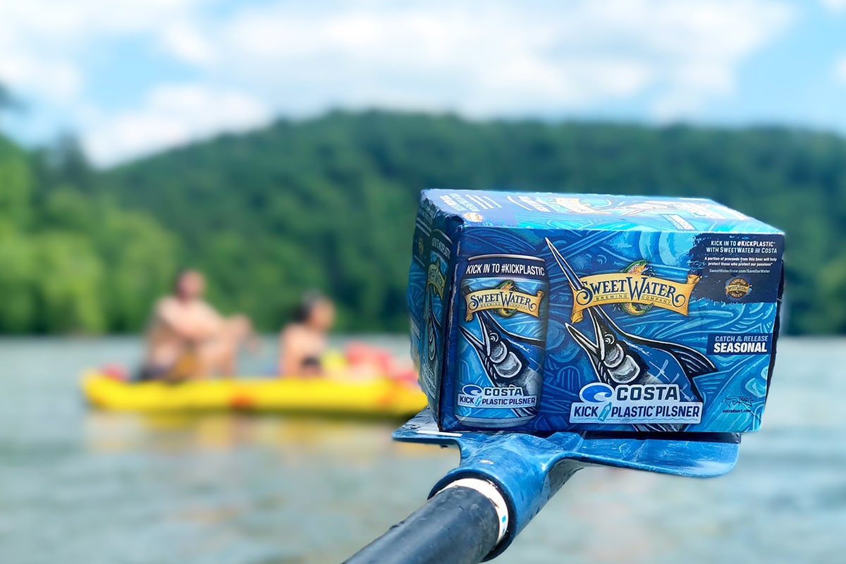 beer package on boat paddle